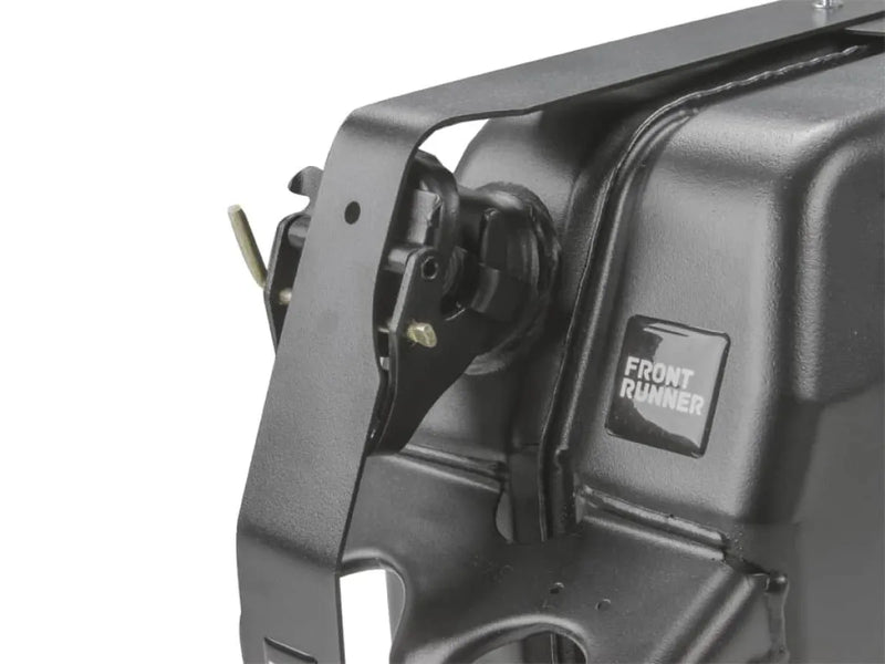 Close-up of a car’s headlight assembly on Front Runner Single Jerry Can Holder stainless steel black powder coated