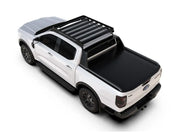 White pickup truck with slimline ii roof rack tray and black roof rack cover