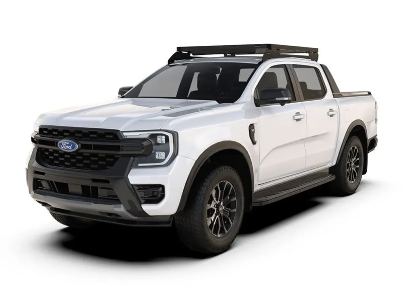 White Ford Ranger pickup truck with roof rack and off-road tires featuring Slimline II tray
