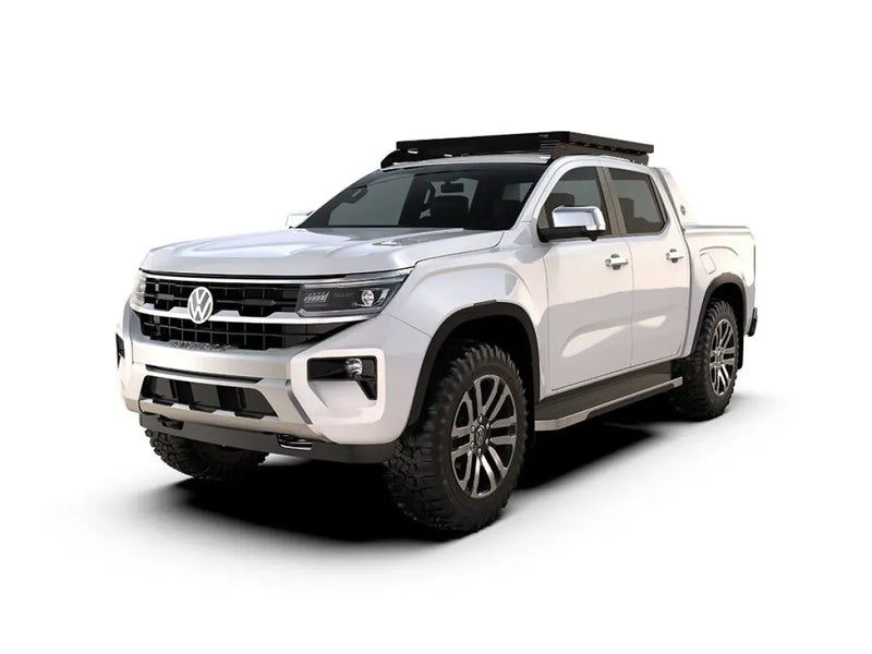 White Volkswagen pickup with rugged off-road styling featuring Slimline II tray roof rack