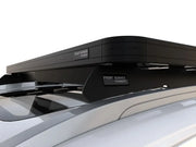 Sleek black roof rack cargo carrier mounted on vehicle rails for Nissan X-Trail/Rogue