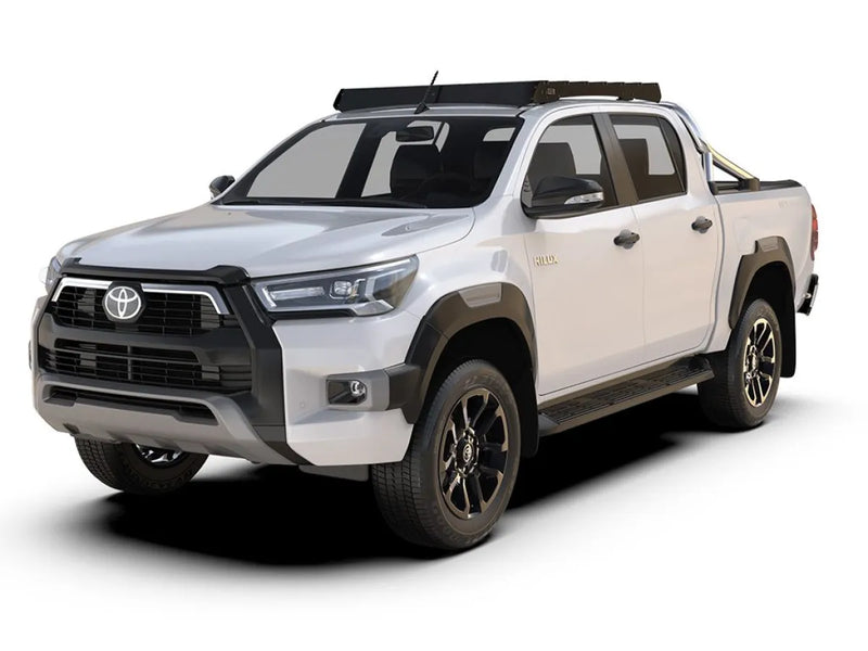 White Toyota Hilux pickup truck with off-road roof rack kit for 2015-current models
