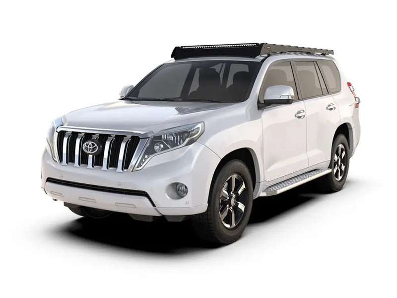 White Toyota Land Cruiser SUV with Slimsport rack kit and roof rack for Toyota Prado