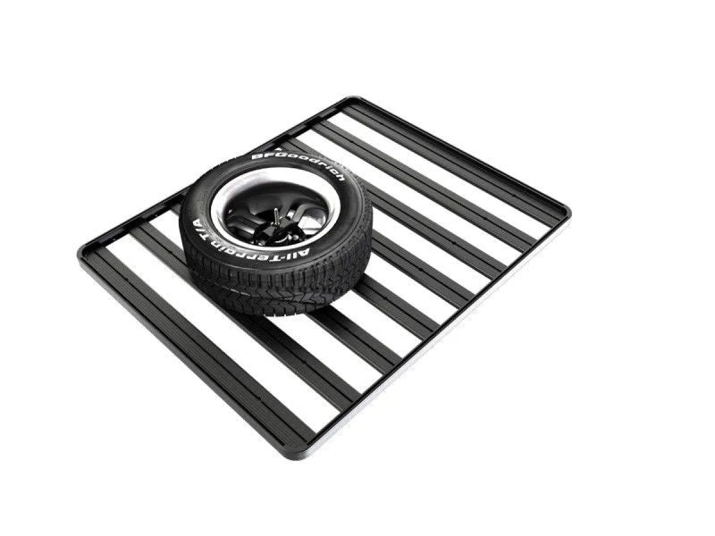 Front Runner spare wheel with low profile clamp resting on black and white striped surface