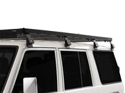 Roof rack kit installed on a white Toyota Land Cruiser 76 for outdoor adventure storage
