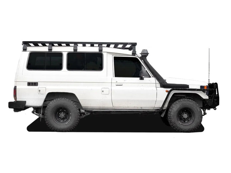 White off-road vehicle with Front Runner Toyota Land Cruiser 78 Slimline II roof rack kit