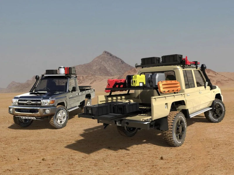 Rugged off-road vehicles with Front Runner Toyota Land Cruiser SC Ute Slimline II roof rack kit in desert terrain