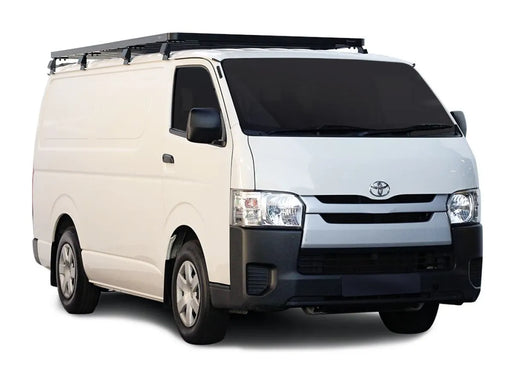 White Toyota cargo van with roof rack kit and roof rack for Toyota Quantum 2004+