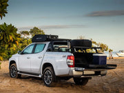 Silver pickup truck with camping gear on Front Runner Ute Slimline II Load Bed Rack Kit