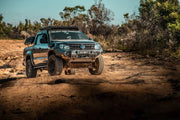 Rugged off-road Volkswagen Amarok with slimline II tray roof rack kit and oversized tires