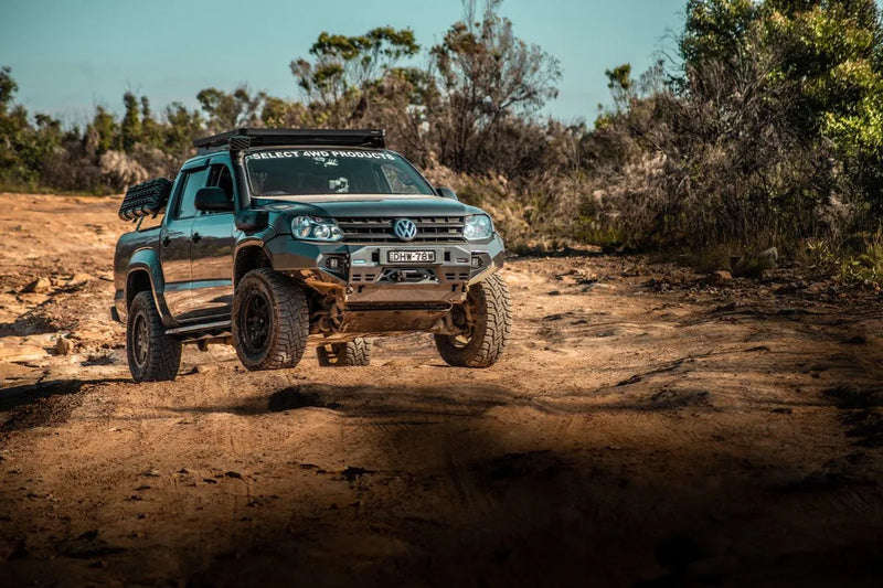 Rugged off-road Volkswagen Amarok with slimline II tray roof rack kit and oversized tires