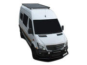 White and black passenger van with a roof rack kit and Slimline II roof rack
