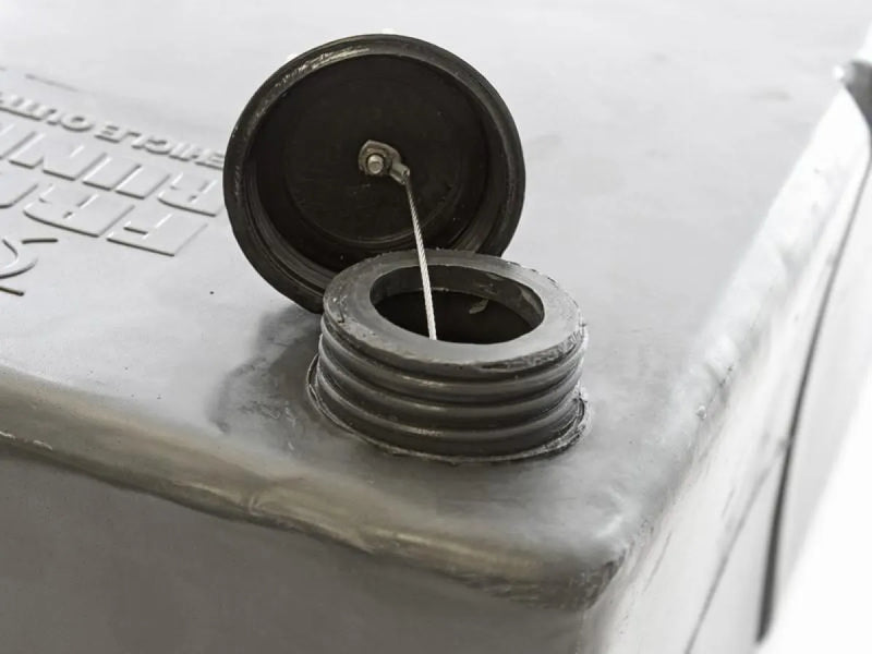 Circular electrical outlet with hinged cover on Front Runner Water Tank 67L for vehicle water supply