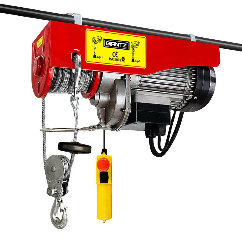 Electric hoist with double rope, red and yellow body, steel cable, and control pendant