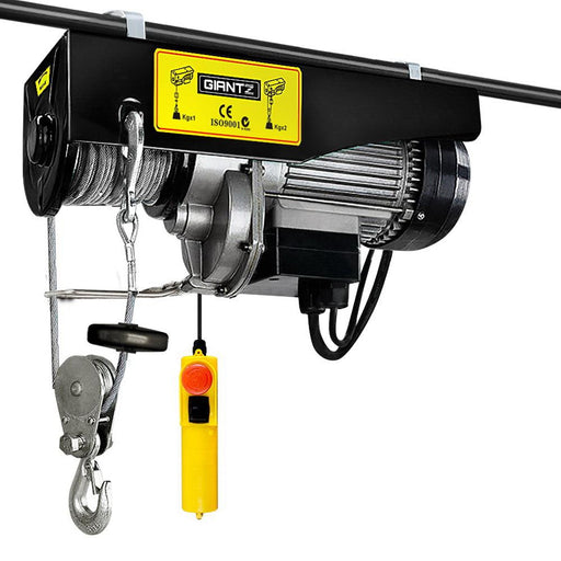 Electric hoist winch with yellow control panel and hanging hook mechanism for heavy lifting