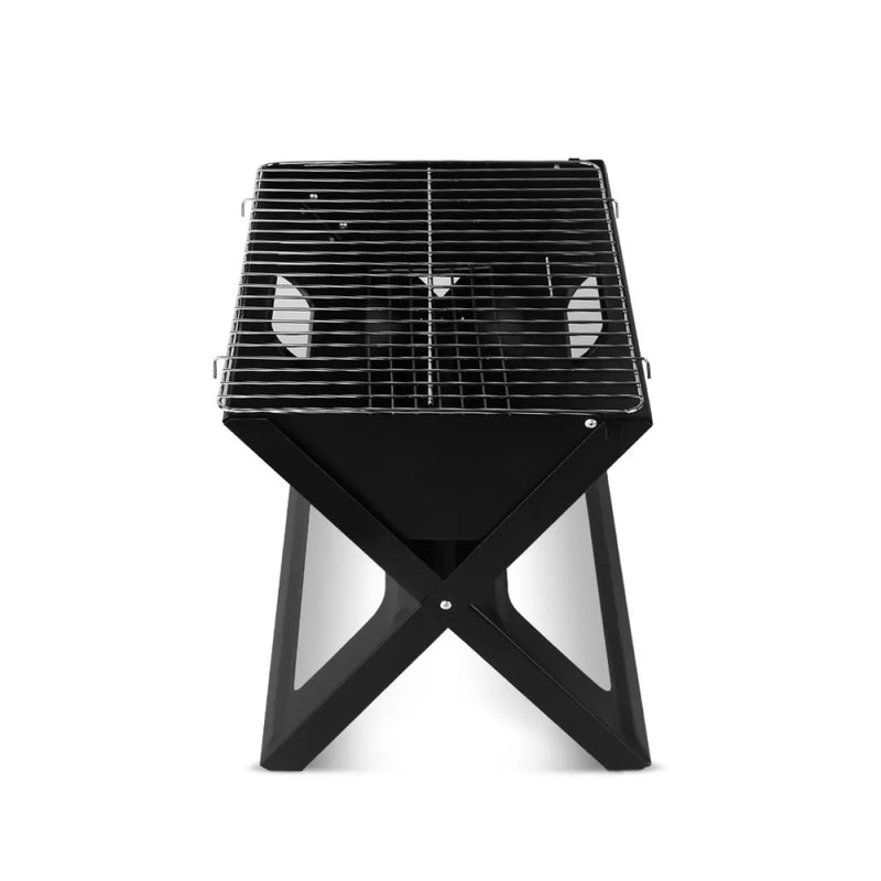 Portable charcoal bbq grill with black X-shaped base and metal grate top for outdoor cooking