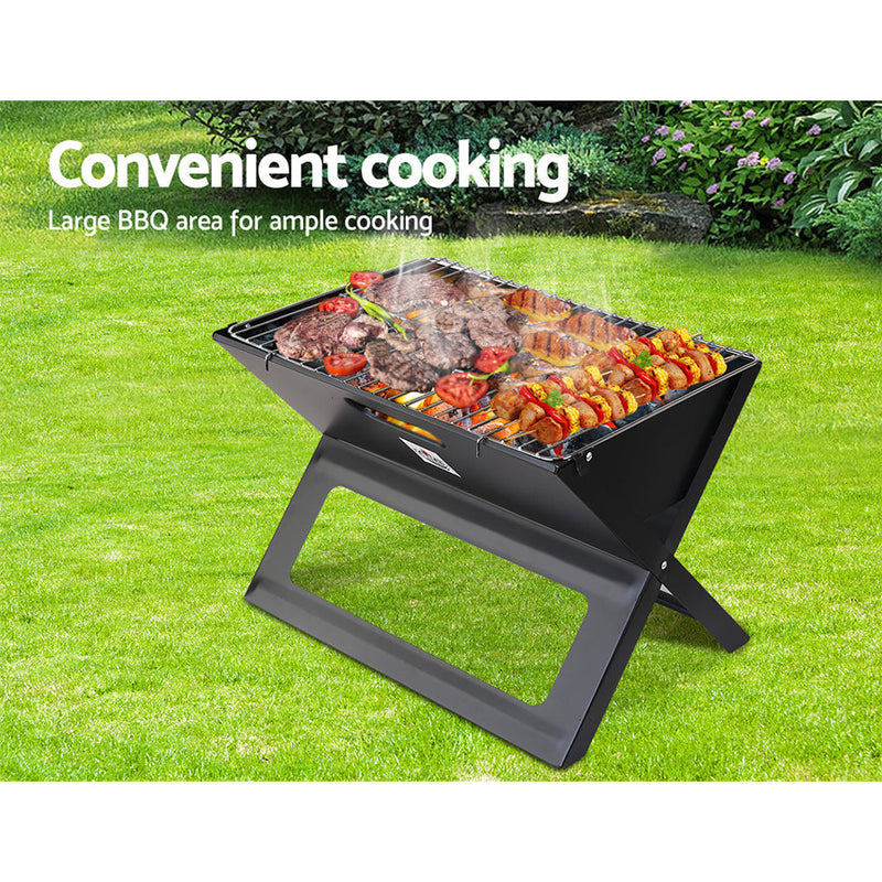 Portable charcoal bbq Grillz Notebook with meats and vegetables for outdoor grilling