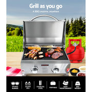 Portable stainless steel gas bbq with open lid cooking meats on grates