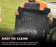 Black rubber car floor mats being cleaned with water spray for Kiwi Master 3D TPE Car Floor Mats for Isuzu MU-X 2013-2020