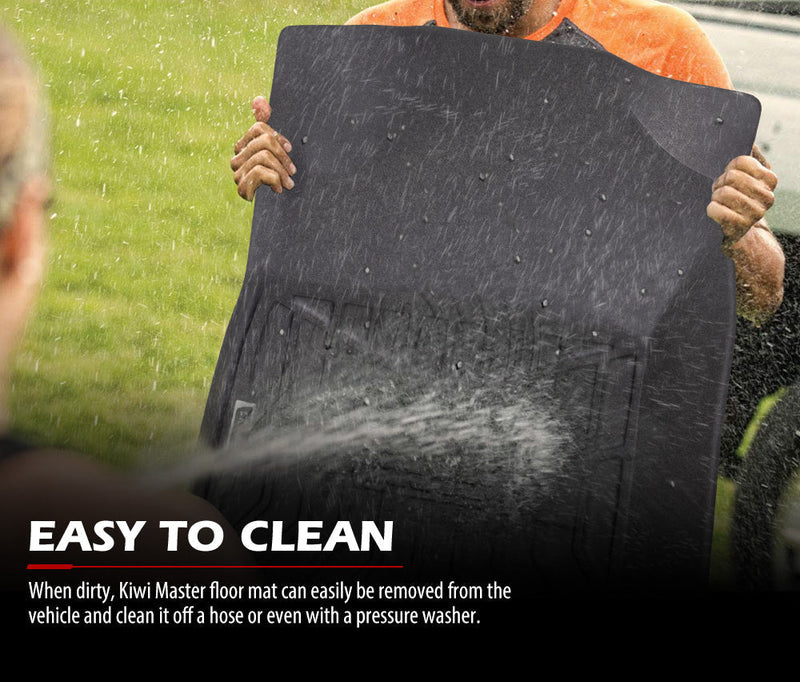 Black rubber car floor mats being sprayed with water showing easy-to-clean feature for Toyota Hilux dual