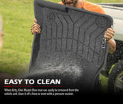 Black rubber car floor mats with textured pattern being cleaned outdoors for Mazda CX-5 KF