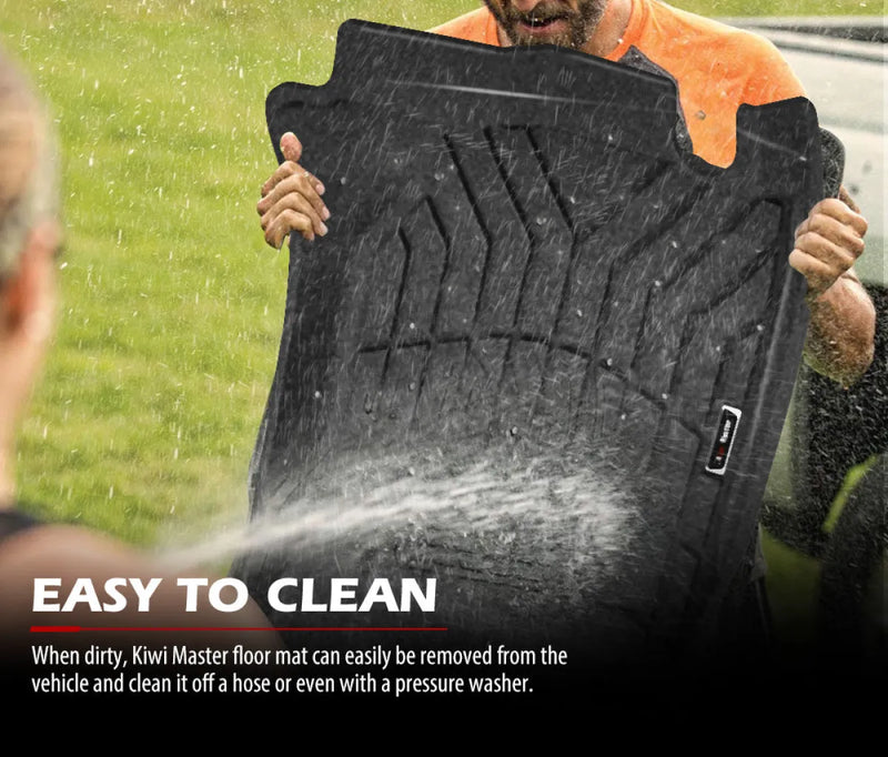 Black rubber floor mats being cleaned with pressure washer for Mitsubishi Triton Kiwi Master