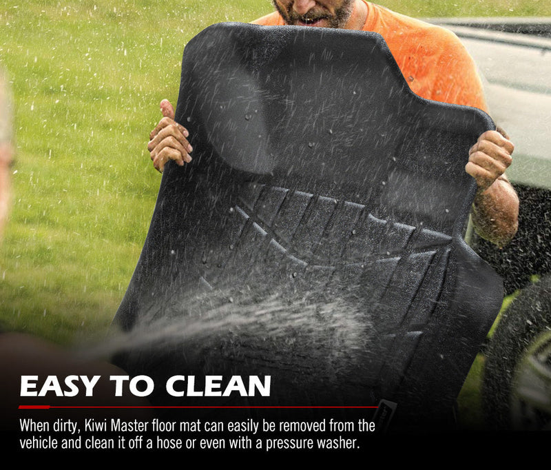 Black rubber Nissan Navara NP300 D23 floor mat being cleaned with water spray