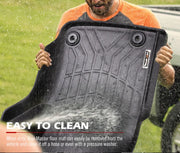 Black rubber car floor mat being sprayed with water for Toyota Landcruiser 79 Series floor mats