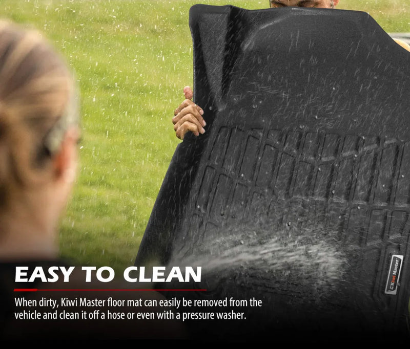 Black rubber car floor mats being sprayed with water for Kiwi Masters 3D TPE Car Floor Mats