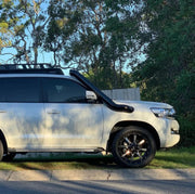 White Toyota Land Cruiser SUV with stainless steel snorkel kit and snorkel intake