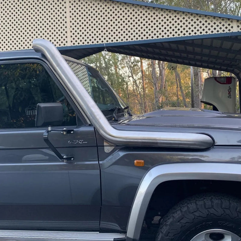 Gray off-road vehicle with stainless steel snorkel and exhaust system for Toyota Landcruiser