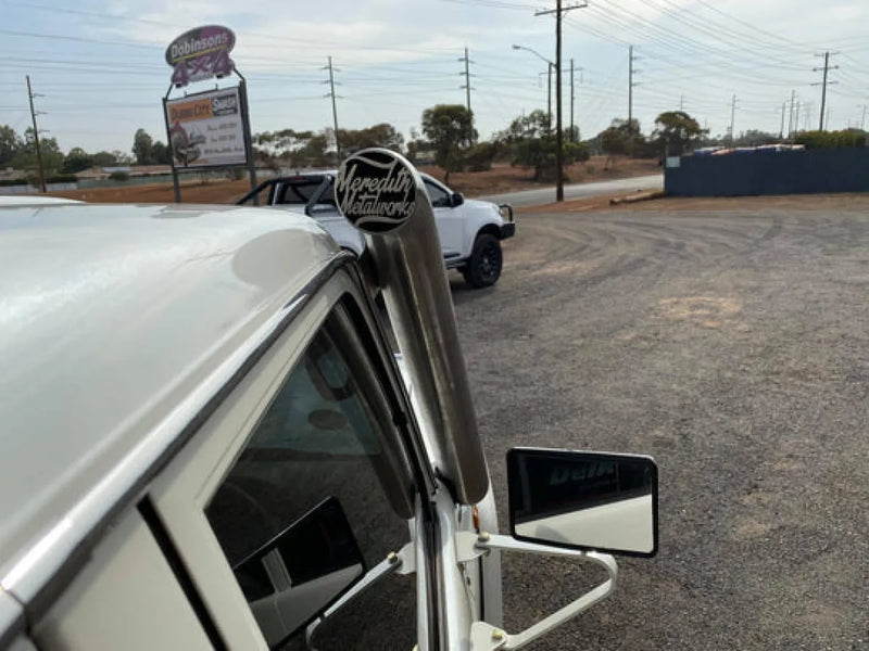 Chrome side mirror on classic Landcruiser with Meredith stainless steel snorkel kit