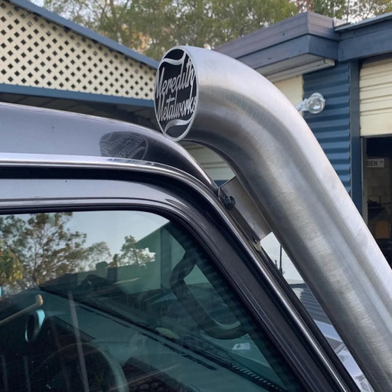 Stainless steel snorkel attachment on a Toyota Landcruiser roof for off-road protection