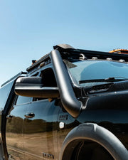Stainless steel 5th gen snorkel kit on off-road vehicle with roof rack and snorkel attachment