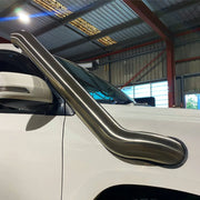 Stainless steel snorkel attached to Toyota 200 Series Landcruiser for off-road protection