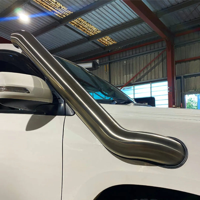 Stainless steel snorkel attached to Toyota 200 Series Landcruiser for off-road protection