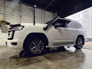 White luxury SUV with sleek styling and alloy wheels featuring stainless steel snorkel for Toyota 300 Series Landcruiser
