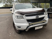 White Holden Colorado pickup truck with damaged front bumper featuring Meredith stainless steel snorkel