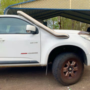 White Toyota Hilux pickup truck with stainless steel snorkel kit for off-road adventures