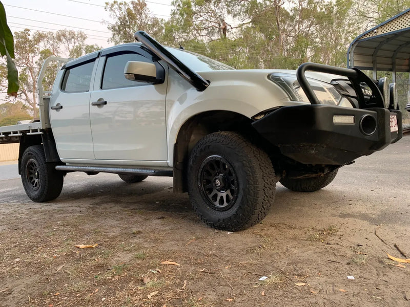 Off-road capable pickup truck with stainless steel snorkel and bull bar for enhanced durability