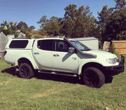 White Mitsubishi Triton pickup truck with canopy showcasing Meredith stainless steel snorkel kit