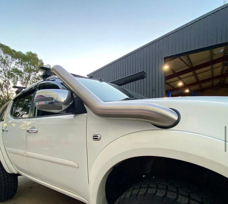 White pickup truck with stainless steel snorkel kit featuring tall steel snorkel for Mitsubishi Triton