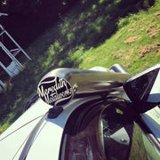 Black motorcycle helmet with Meredith Motorcycles branding, sleek stainless steel look