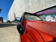 Red vintage car with curved fender and side mirror, ideal for Mitsubishi Pajero Sport stainless steel snorkel kit