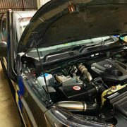 Car engine compartment with open hood showing mechanical components for Meredith Stainless Steel Snorkel Kit