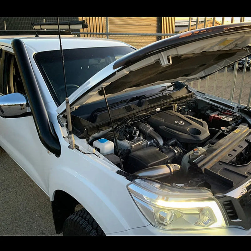 White car with open engine hood showcasing Meredith stainless steel snorkel kit for Nissan Navara NP300