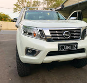 White Nissan pickup truck with stainless steel snorkel and prominent grille image