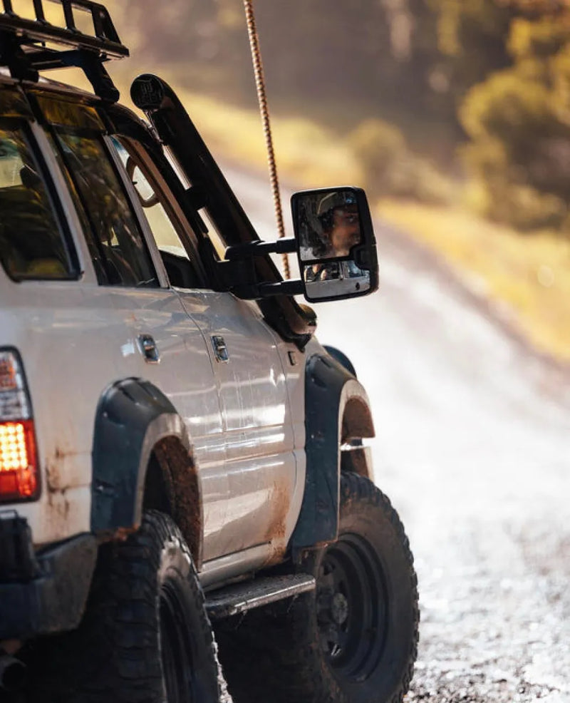 Off-road vehicle with rugged tires and roof rack showcasing Meredith stainless steel snorkel kit