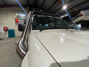 White pickup truck with a prominent stainless steel snorkel air intake for Toyota 80 Series Landcruiser