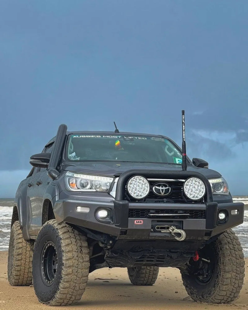 Modified Toyota Hilux pickup truck with stainless steel snorkel kit for off-road adventures